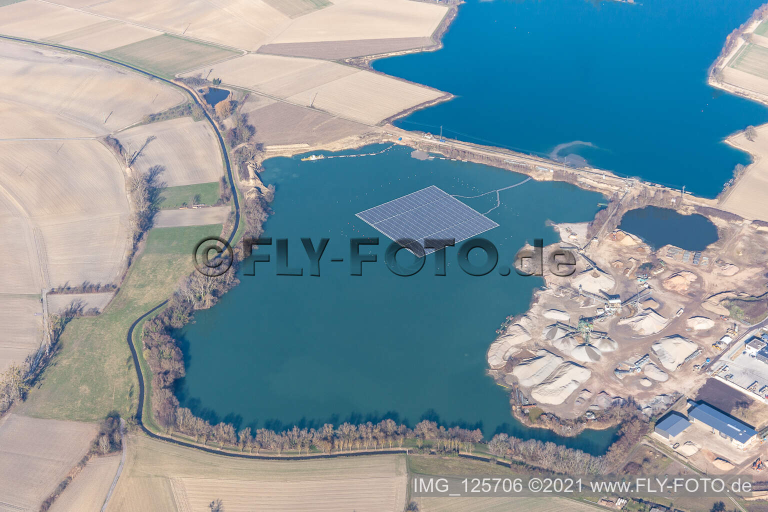 Floating photovoltaic system on the quarry lake of the Markus Wolf gravel works in Leimersheim in the state Rhineland-Palatinate, Germany