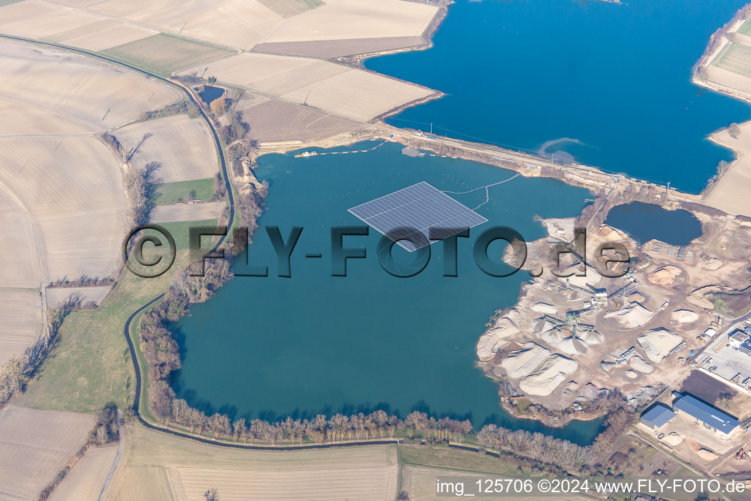 Floating photovoltaic system on the lake of the Markus Wolf gravel works in Leimersheim in the state Rhineland-Palatinate, Germany