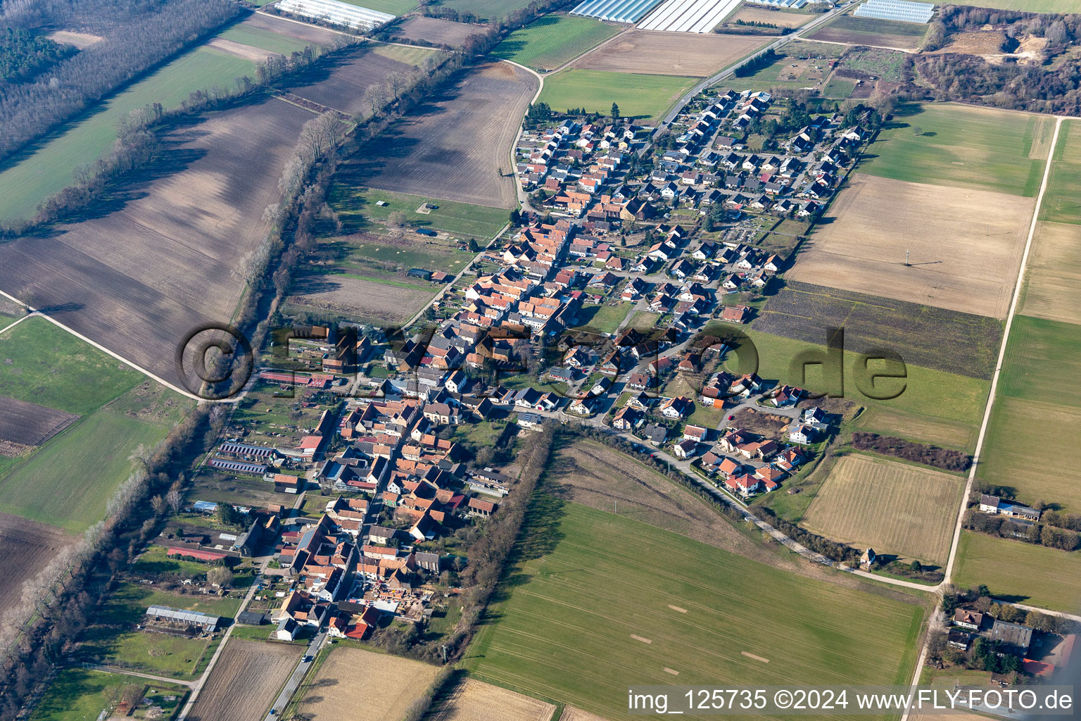 Aerial photograpy of Village - view on the edge of agricultural fields and farmland in Herxheimweyher in the state Rhineland-Palatinate, Germany