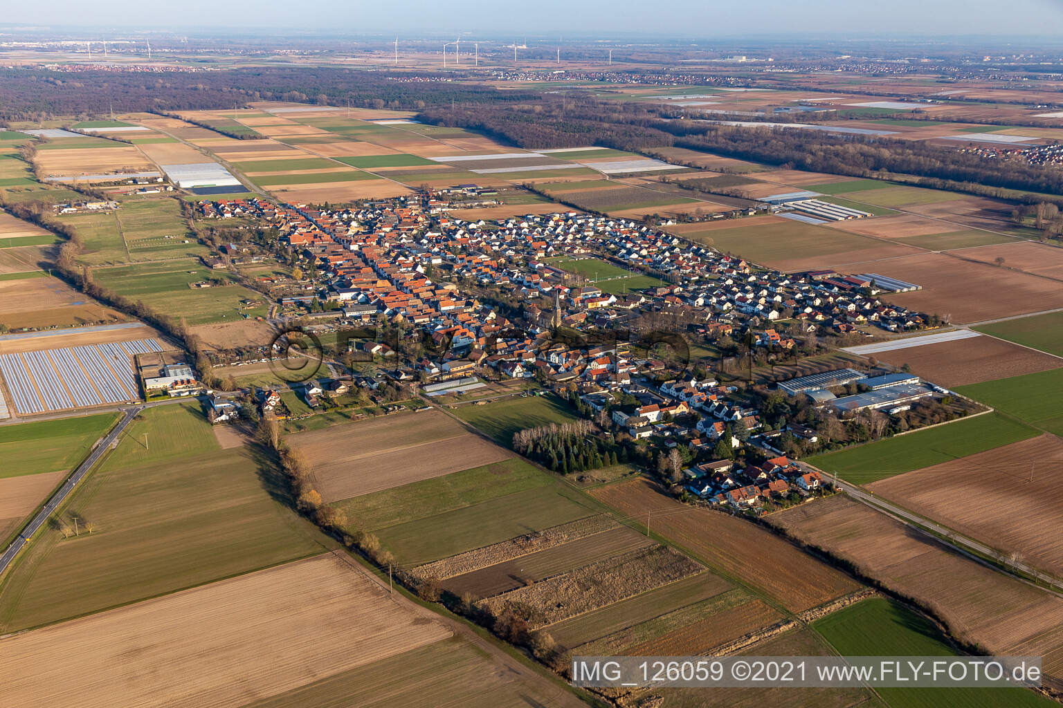 Village view on the edge of agricultural fields and land in Gommersheim in the state Rhineland-Palatinate, Germany