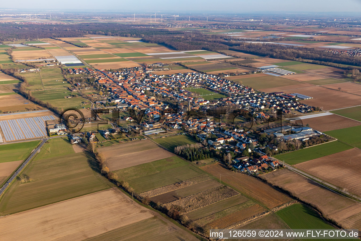 Village view on the edge of agricultural fields and land in Gommersheim in the state Rhineland-Palatinate, Germany