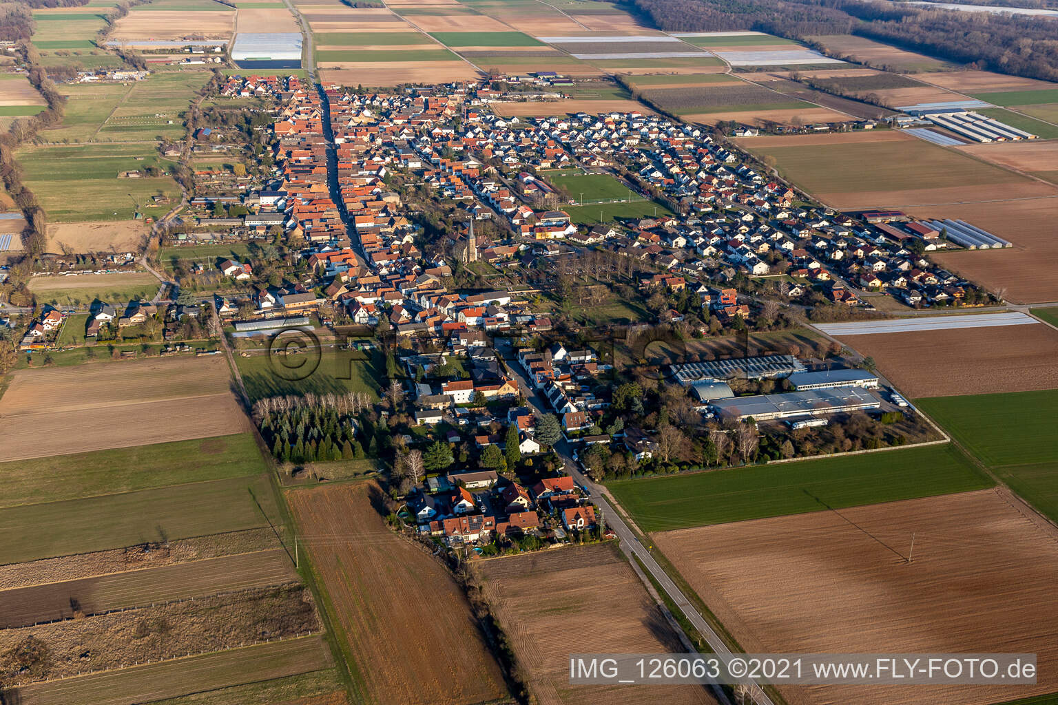 Aerial view of Village view on the edge of agricultural fields and land in Gommersheim in the state Rhineland-Palatinate, Germany
