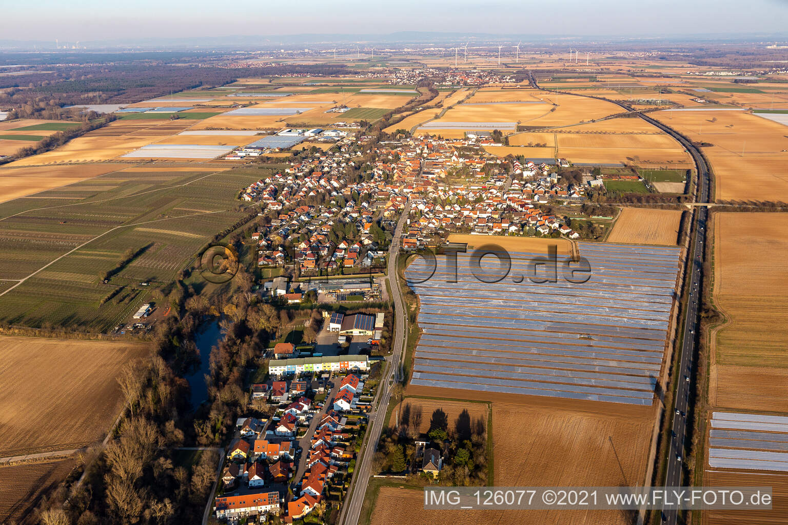 Aerial view of Agricultural land and field boundaries surround the settlement area of the village in Weingarten (Pfalz) in the state Rhineland-Palatinate, Germany