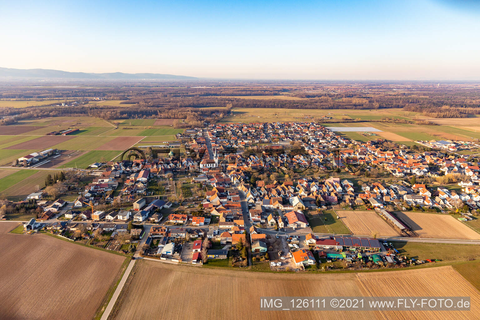 Aerial photograpy of Village - view on the edge of agricultural fields and farmland in Ottersheim bei Landau in the state Rhineland-Palatinate, Germany
