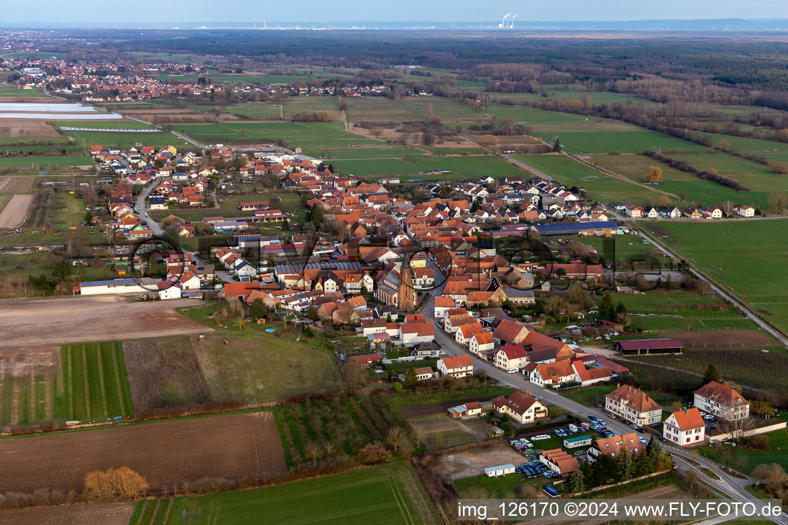 Aerial view of Village - view on the edge of agricultural fields and farmland in Schweighofen in the state Rhineland-Palatinate, Germany