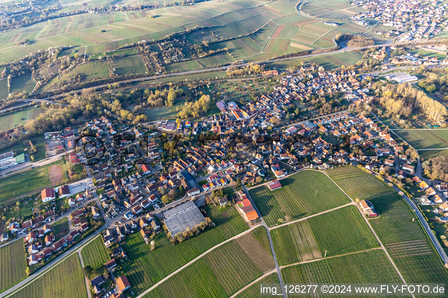 Aerial photograpy of Building complex of the Institute Julius Kuehn Rebforschungsanstalt Geilweilerhof mit bluehenden Mandelbaeumen in Siebeldingen in the state Rhineland-Palatinate, Germany