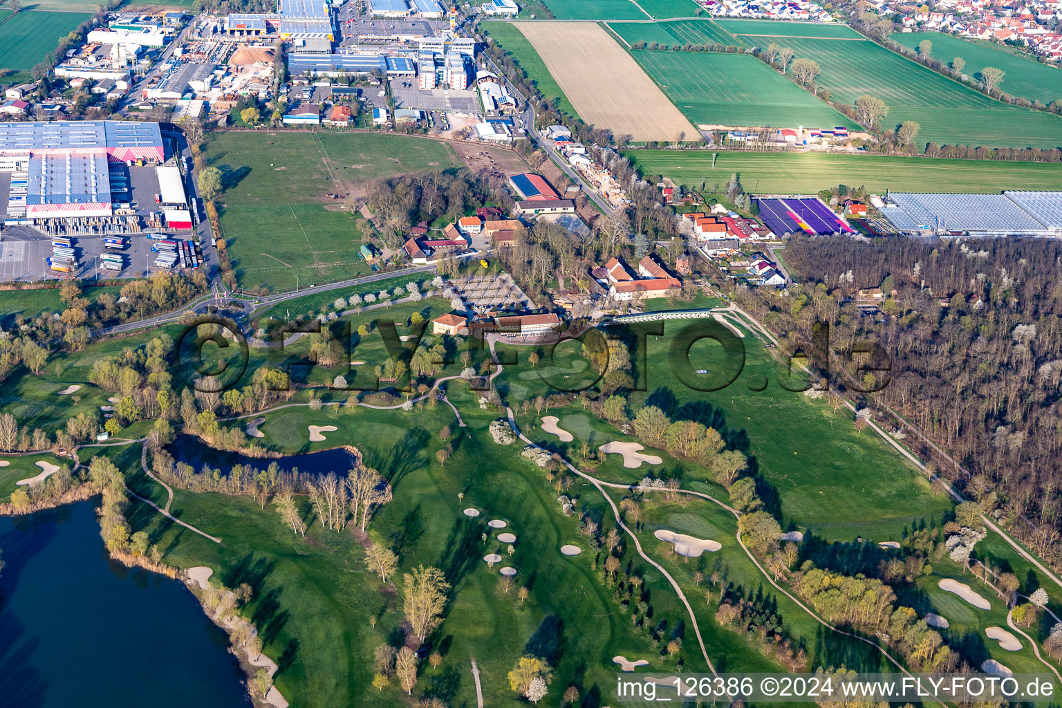 Blooming trees in the spring on the grounds of the Golf course at Landgut Dreihof GOLF absolute in Essingen in the state Rhineland-Palatinate from above