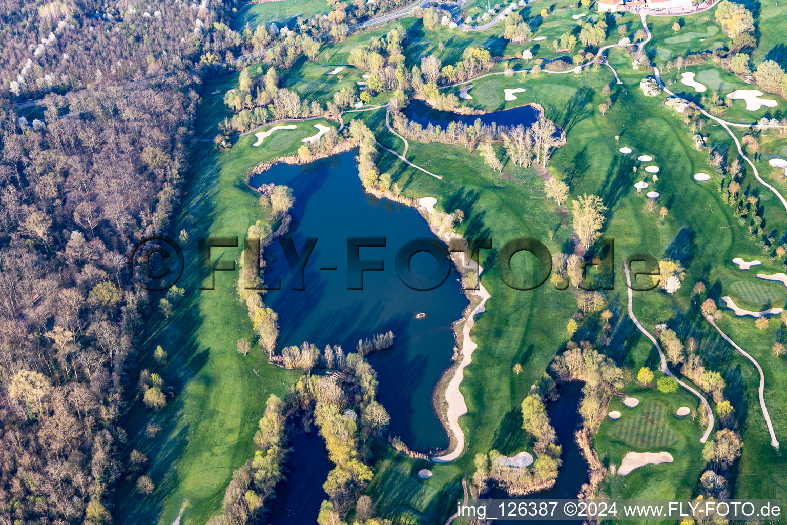 Blooming trees in the spring on the grounds of the Golf course at Landgut Dreihof GOLF absolute in Essingen in the state Rhineland-Palatinate out of the air