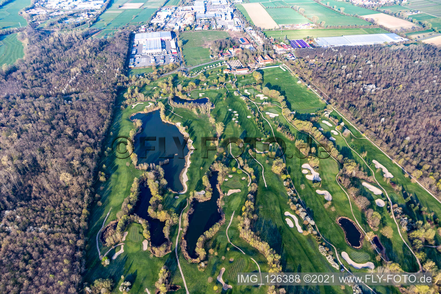Blooming trees in the spring on the grounds of the Golf course at Landgut Dreihof GOLF absolute in Essingen in the state Rhineland-Palatinate seen from above
