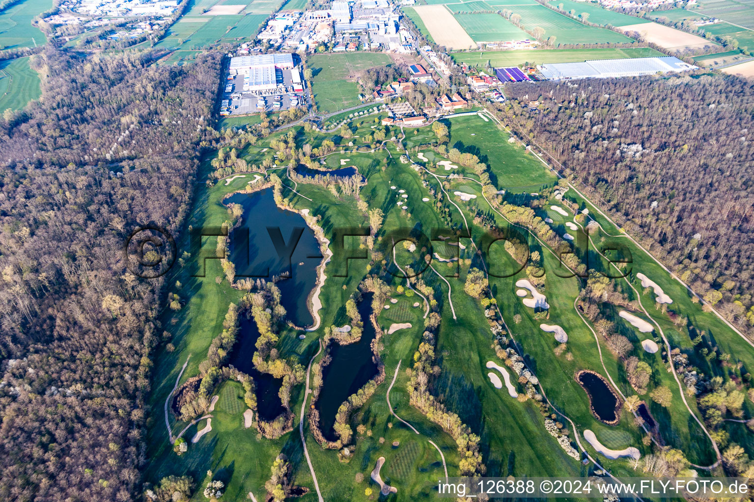 Blooming trees in the spring on the grounds of the Golf course at Landgut Dreihof GOLF absolute in Essingen in the state Rhineland-Palatinate seen from above