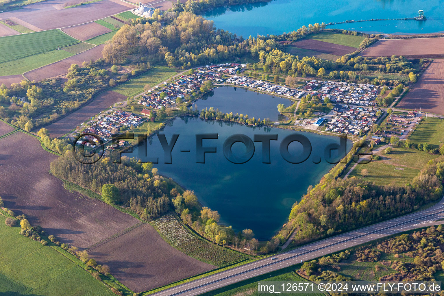 Camping with caravans and tents in Friesenheim at the Schuttern quarry pond in the state Baden-Wurttemberg, Germany