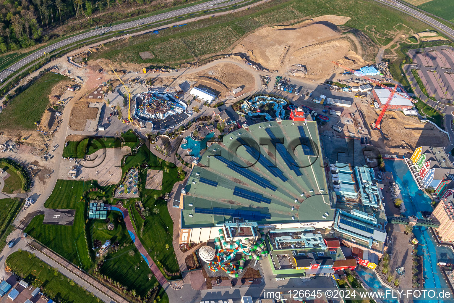 Extension construction site for the Water park "Rulantica" and museum hotel Kronasar on the grounds of the locked down amusement park "Europapark" in Rust in the state of Baden-Wuerttemberg, Germany from above