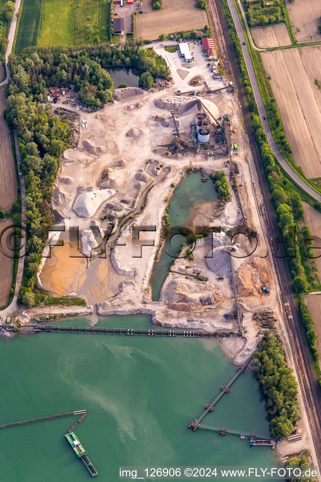 Aerial photograpy of HBM Hagenbacher Bau Mineralstoffe quarry pond in Hagenbach in the state Rhineland-Palatinate, Germany