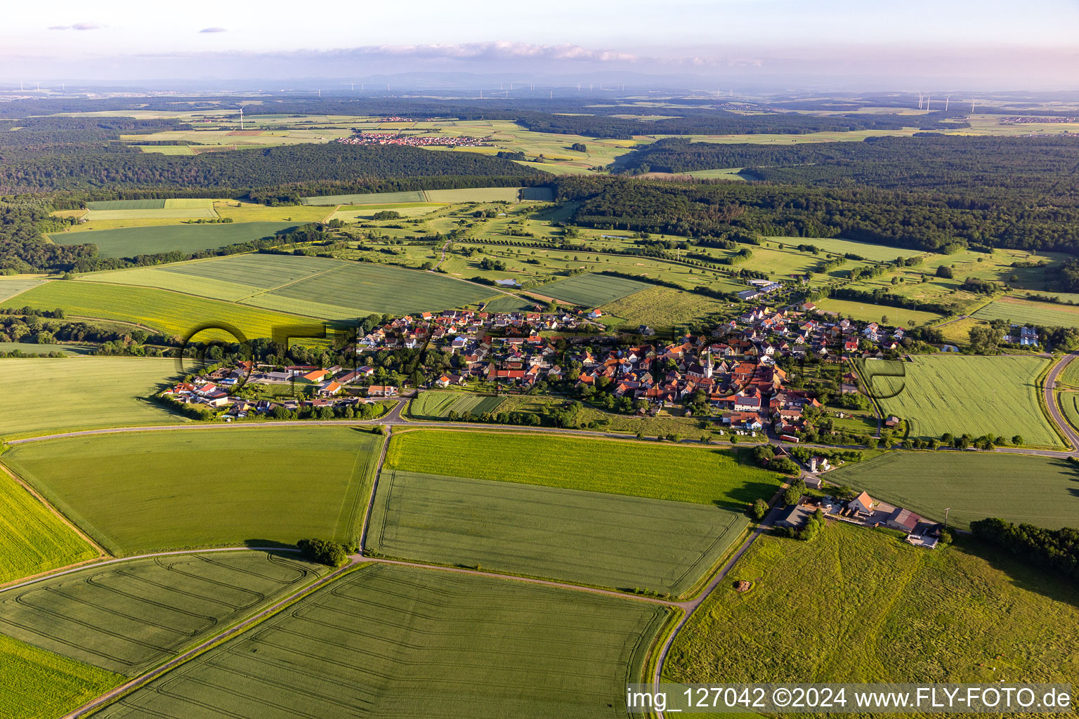 Village view on the edge of agricultural fields and land in Loeffelsterz in the state Bavaria, Germany