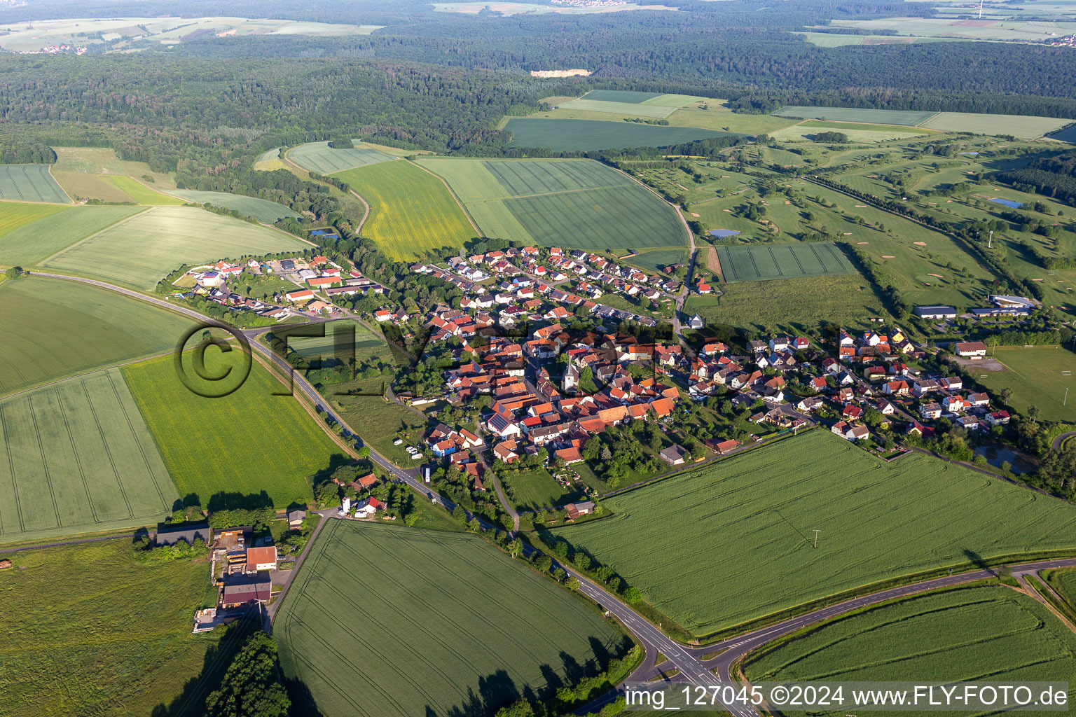 Aerial photograpy of Village view on the edge of agricultural fields and land in Loeffelsterz in the state Bavaria, Germany