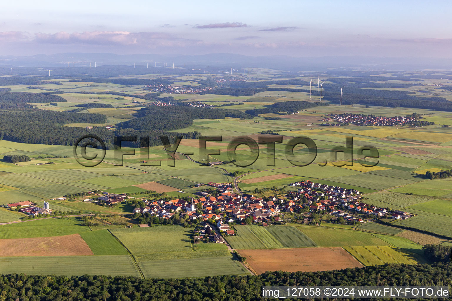 Oblique view of Village - view on the edge of agricultural fields and farmland in Ebertshausen in the state Bavaria