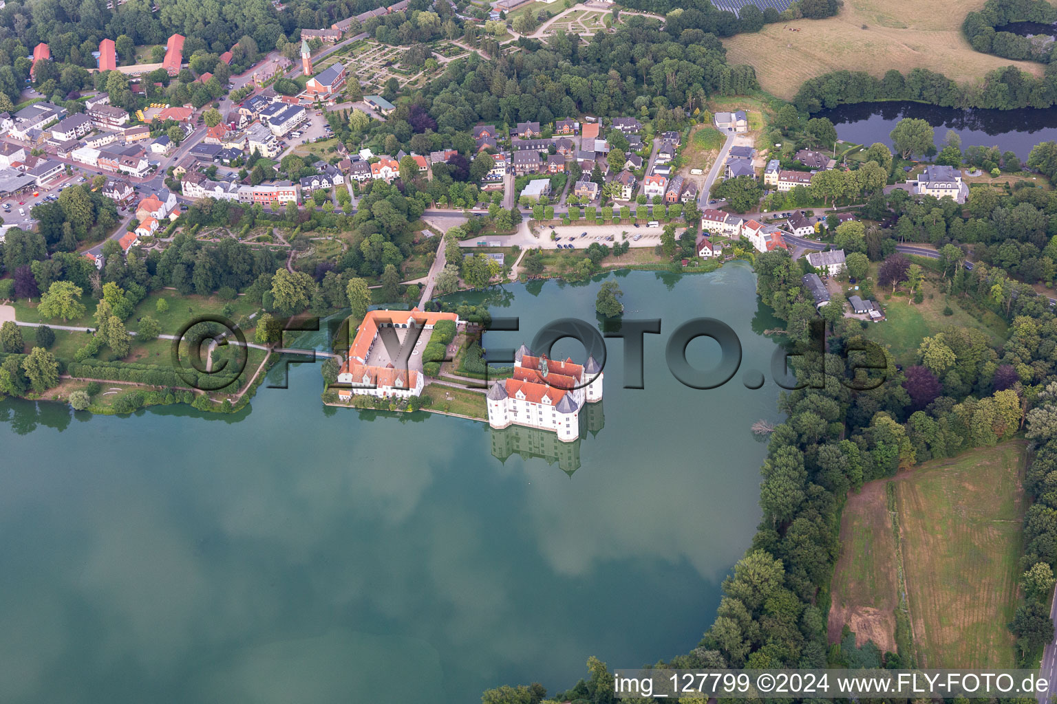 Castle Glücksburg in the castle pond in the district Ulstrupfeld in Glücksburg in the state Schleswig Holstein, Germany from the plane