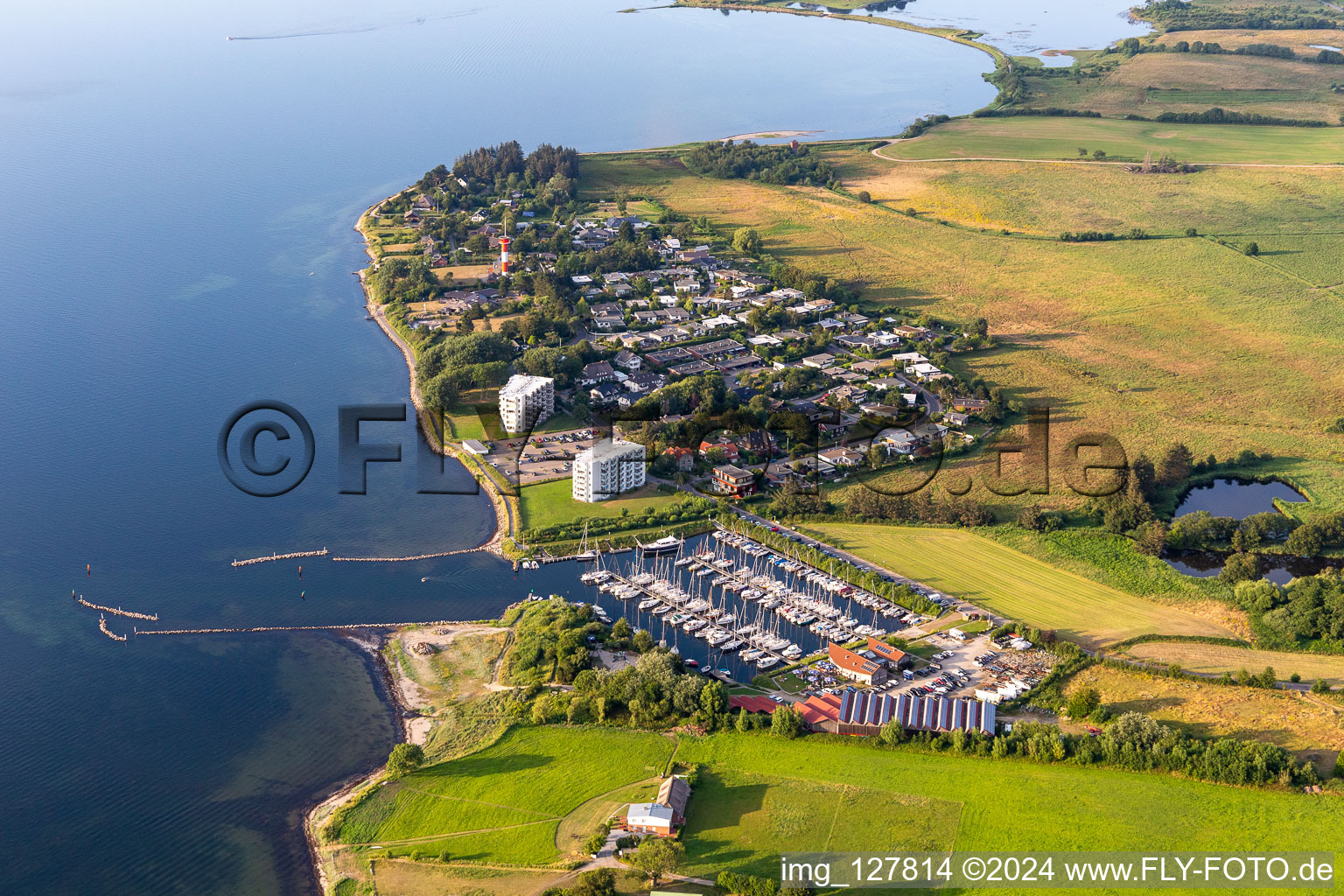 Pleasure boat marina of CLUB NAUTIC e.V. with docks and moorings on the shore area of the Foerde with Restaurant "Leuchtturm" in Schausende in Gluecksburg in the state Schleswig-Holstein, Germany