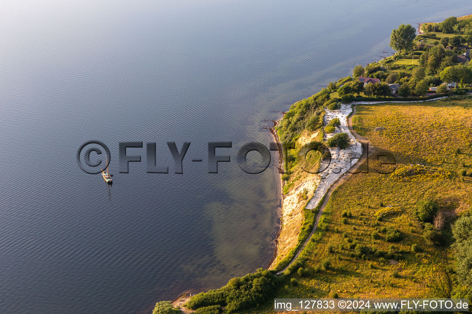 Oblique view of Water surface at the seaside in the Flensburger Foerde in Holnis in the state Schleswig-Holstein, Germany