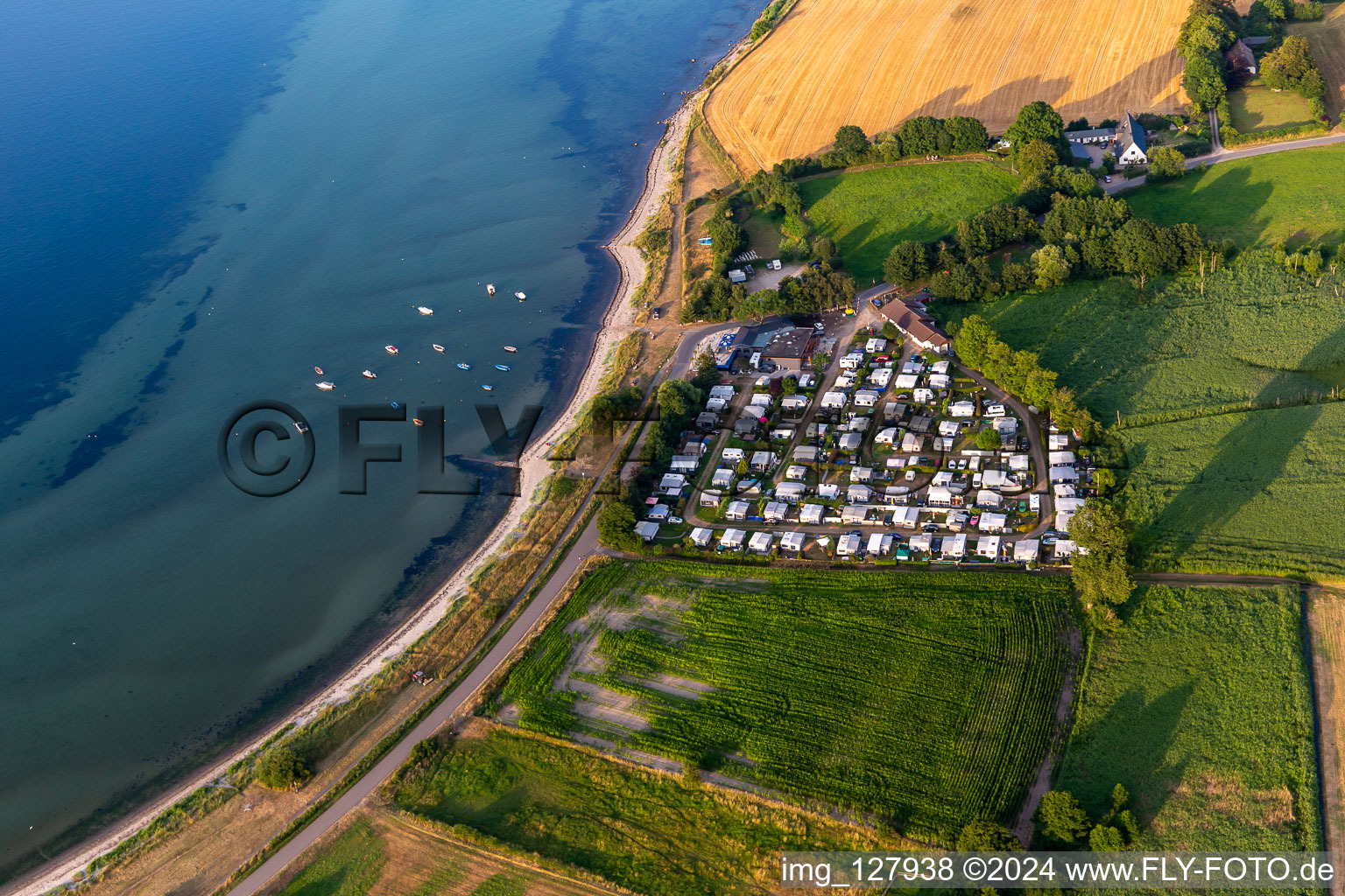 Campsite Habernis with caravans and tents on the shore of Baltic Sea in Steinberg in the state Schleswig-Holstein, Germany