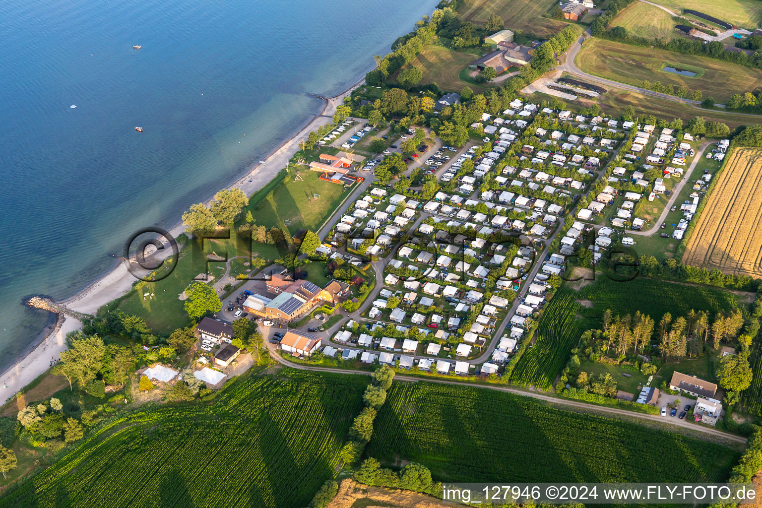 Aerial view of Campsite nordstern with caravans and tents on the baltic sea shore on Seebadeanstalt Norgaardholz in Norgaardholz in the state Schleswig-Holstein, Germany