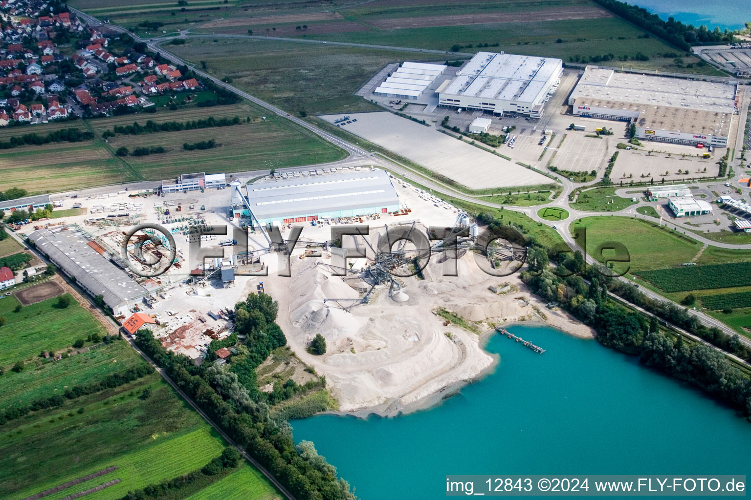 Site and tailings area of the gravel mining at a lake in the district Wiesental in Waghaeusel in the state Baden-Wurttemberg