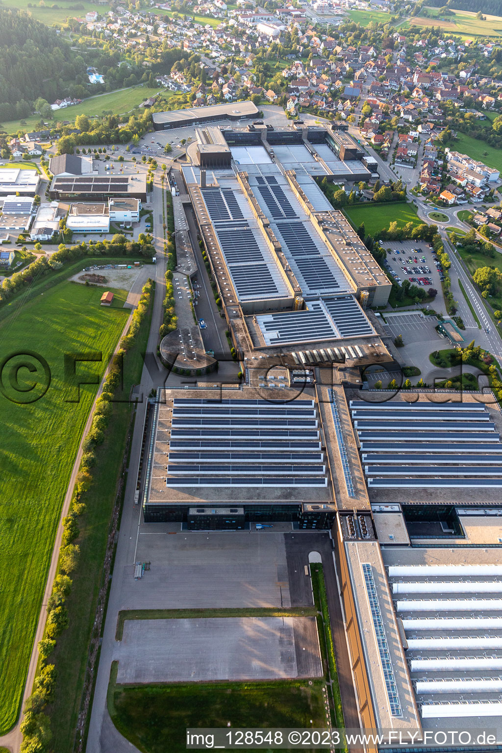 Oblique view of Building and production halls on the premises of ARBURG GmbH + Co KG in Lossburg in the state Baden-Wuerttemberg, Germany