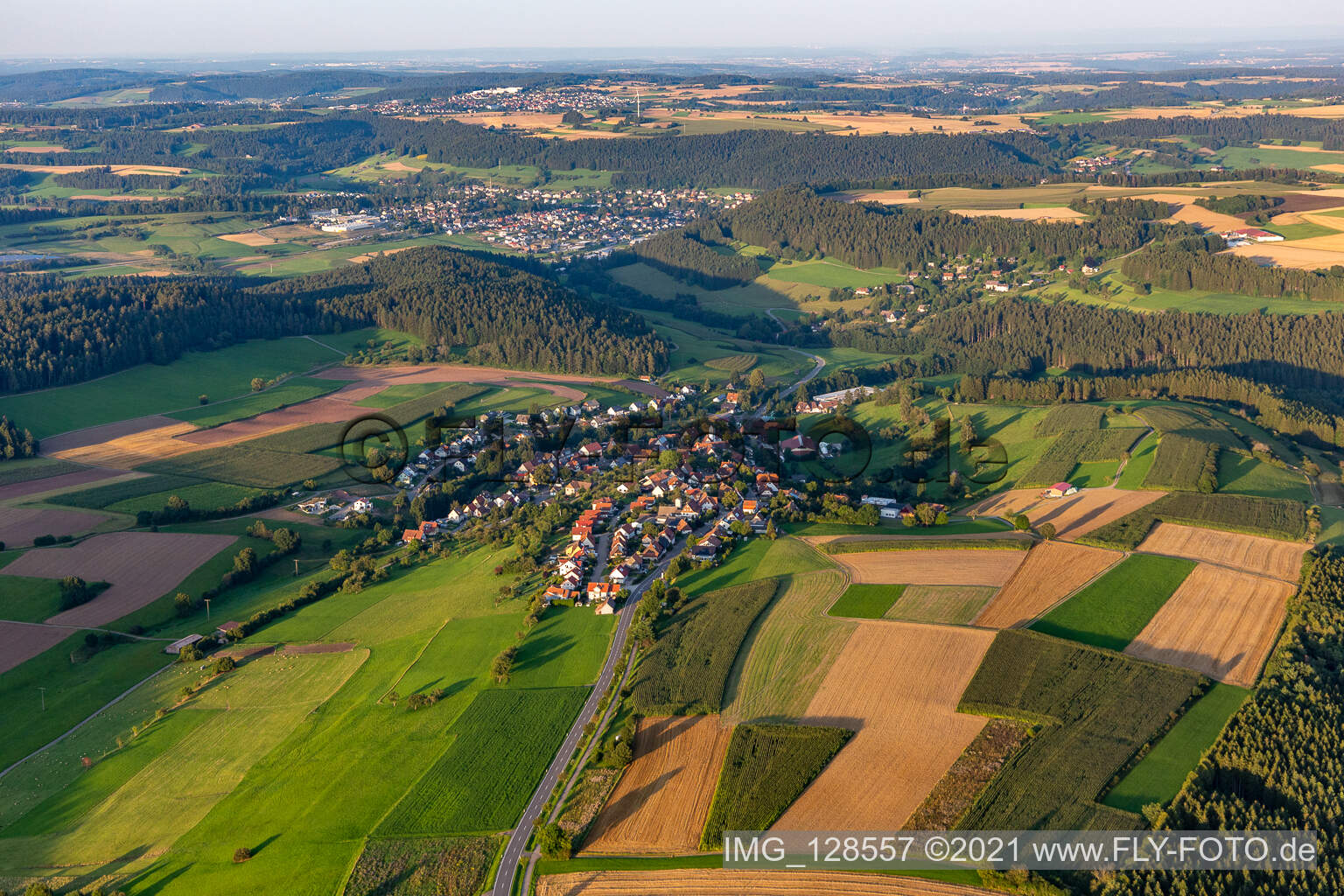 Agricultural land and field boundaries surround the settlement area of the village in Lombach in the state Baden-Wuerttemberg, Germany
