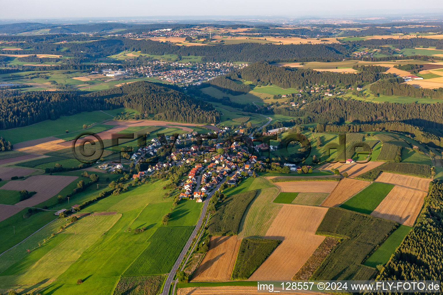 Agricultural land and field boundaries surround the settlement area of the village in Lombach in the state Baden-Wuerttemberg, Germany