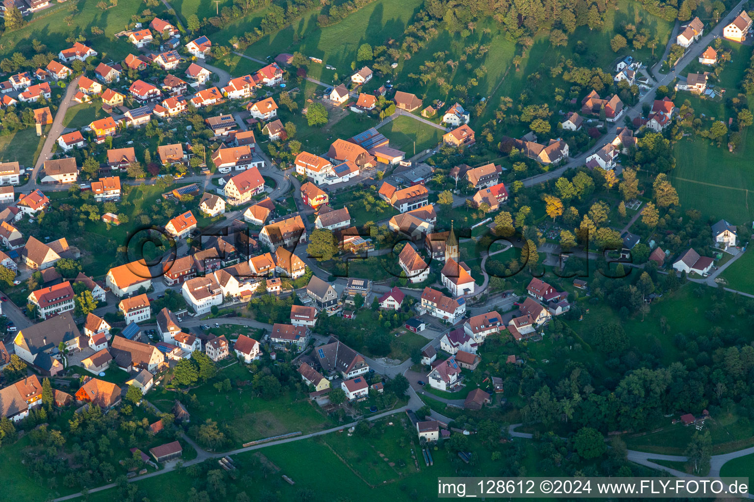 Aerial view of Village view on the edge of agricultural fields and land in Wittendorf at Black-Forest in the state Baden-Wuerttemberg, Germany