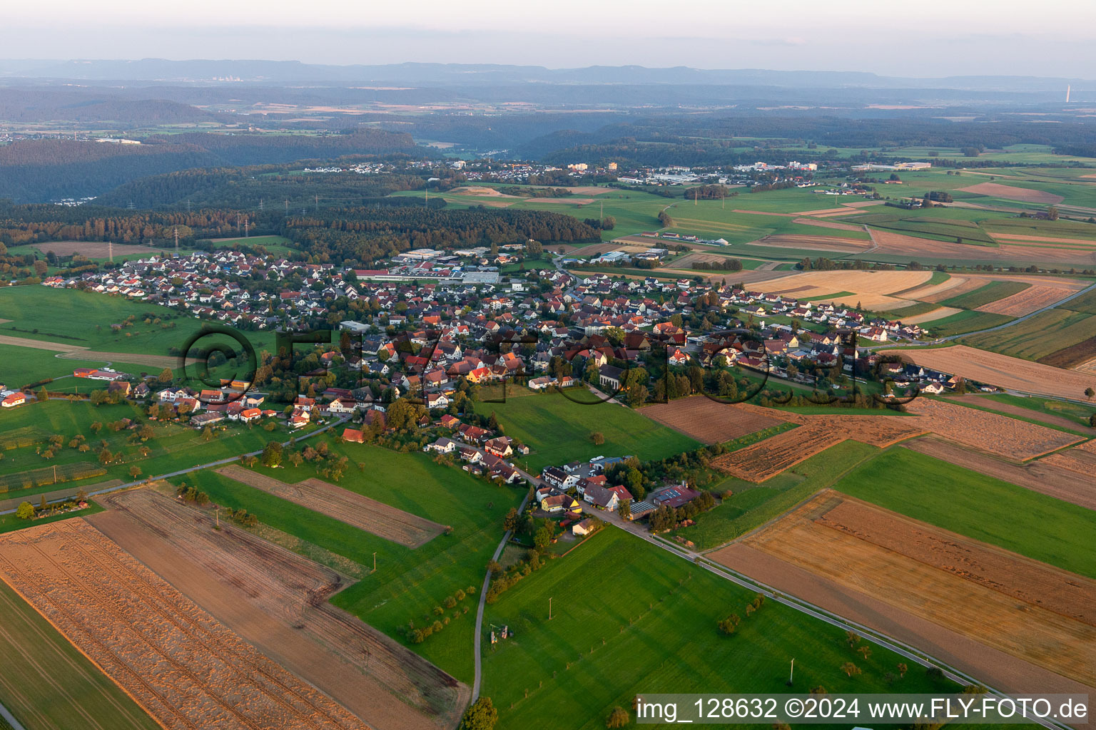 Aerial photograpy of Agricultural land and field borders surround the settlement area of the village in Hochmoessingen in the state Baden-Wurttemberg, Germany