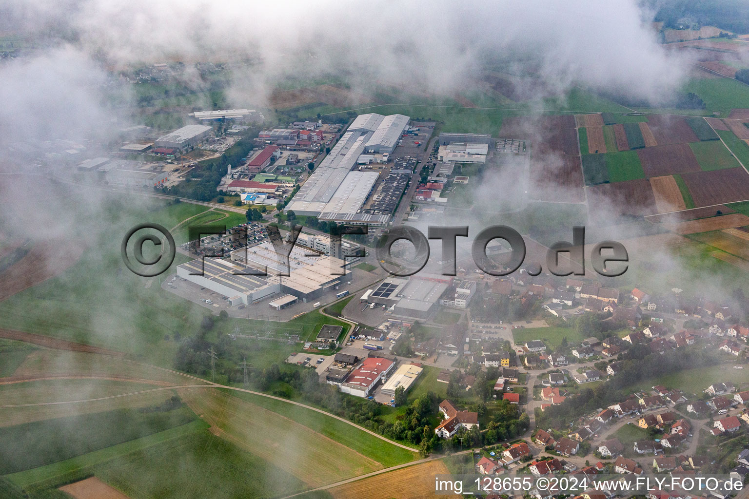 Aerial view of Factory under clouds: Concrete - precast - Union GmbH & Co. KG; Schwäbische Werkzeugmaschinen GmbH, KMS Automation GmbH in the district Waldmössingen in Schramberg in the state Baden-Wuerttemberg, Germany