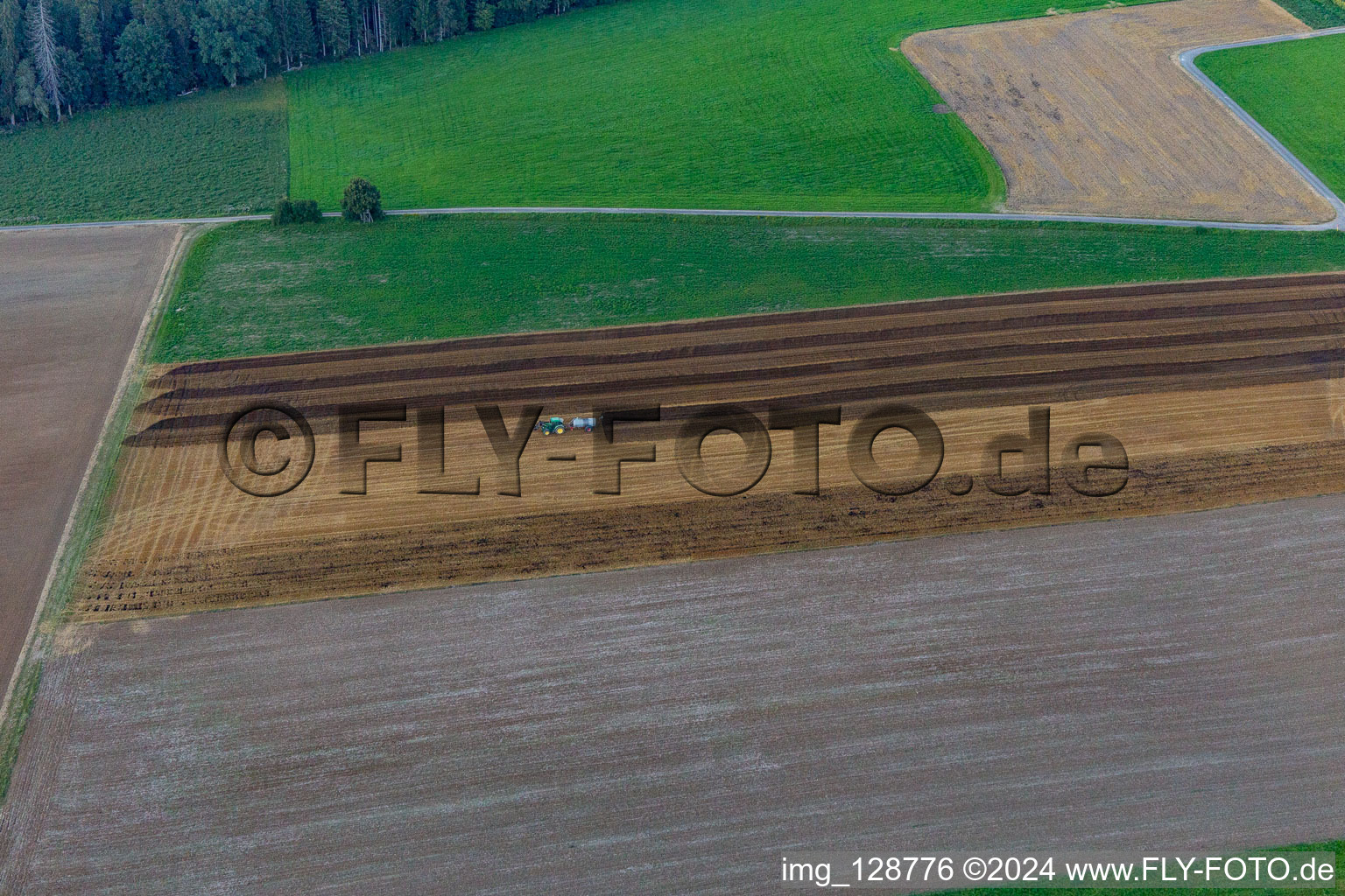 Spreading the manure in Bösingen in the state Baden-Wuerttemberg, Germany