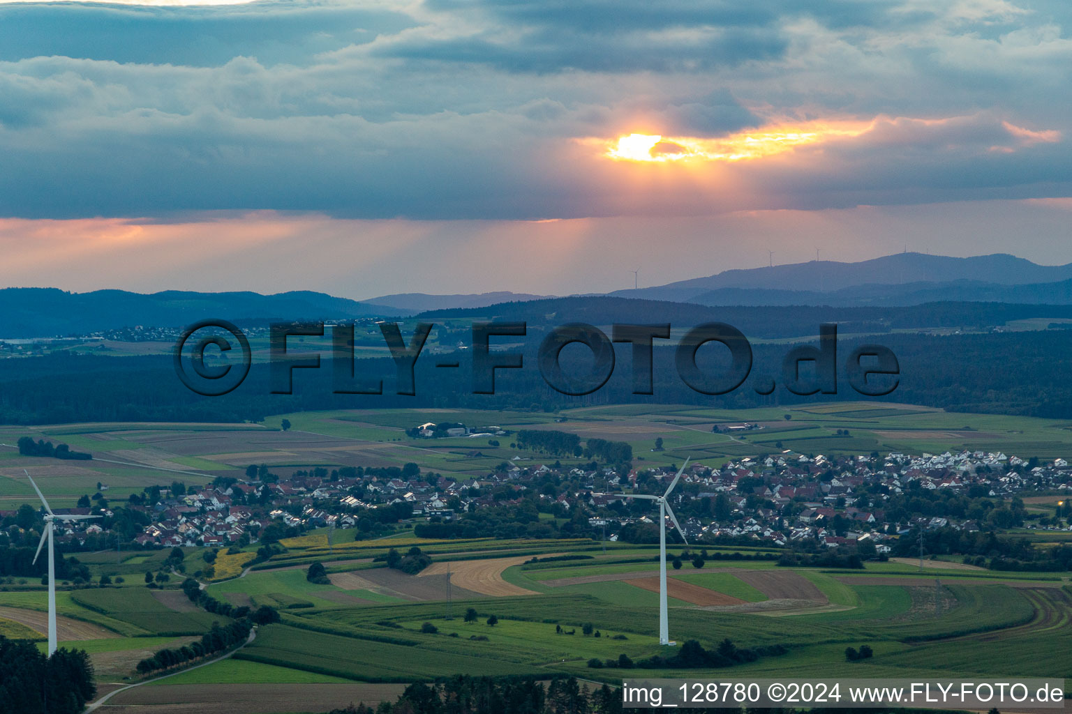 Location at sunset from the east behind wind turbines in the district Waldmössingen in Schramberg in the state Baden-Wuerttemberg, Germany