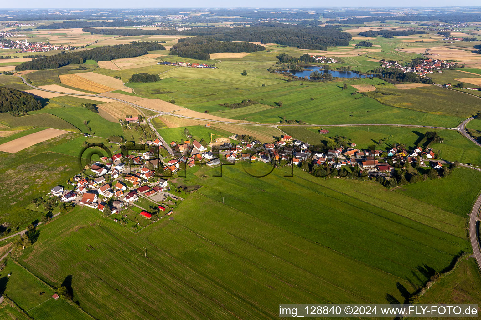 Agricultural land and field boundaries surround the settlement area of the village in Kleinwinnaden in the state Baden-Wuerttemberg, Germany