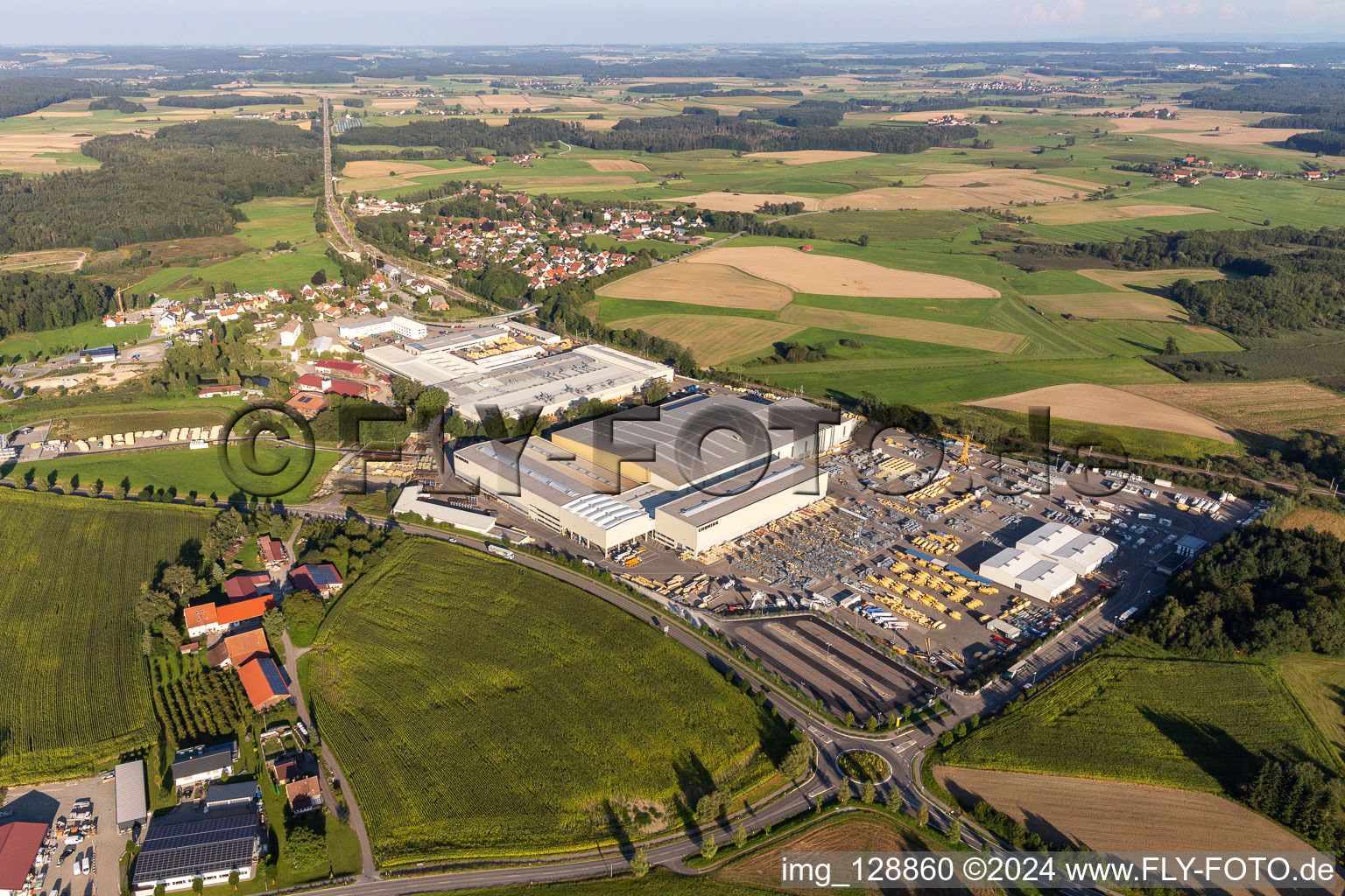 Oblique view of Building and production halls on the premises of Liebherr-Mischtechnik GmbH in Bad Schussenried in the state Baden-Wuerttemberg, Germany