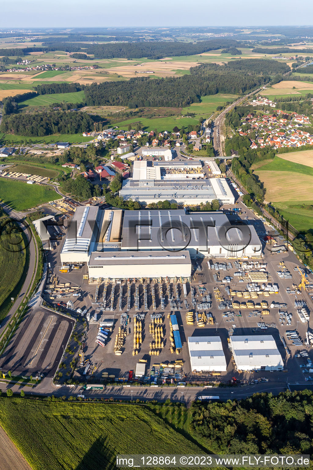 Building and production halls on the premises of Liebherr-Mischtechnik GmbH in Bad Schussenried in the state Baden-Wuerttemberg, Germany seen from above