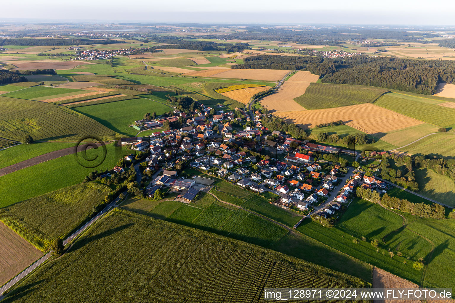 Agricultural land and field boundaries surround the settlement area of the village in Bierstetten in the state Baden-Wuerttemberg, Germany