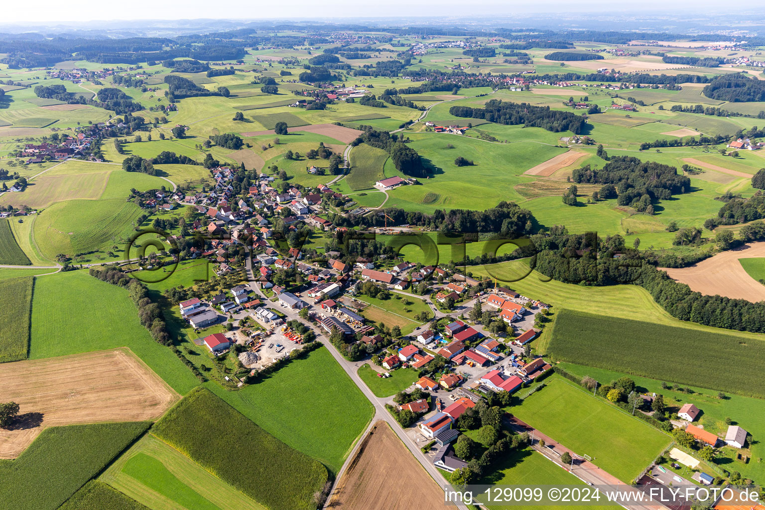 Agricultural land and field boundaries surround the settlement area of the village in Wetzisreute in the state Baden-Wuerttemberg, Germany