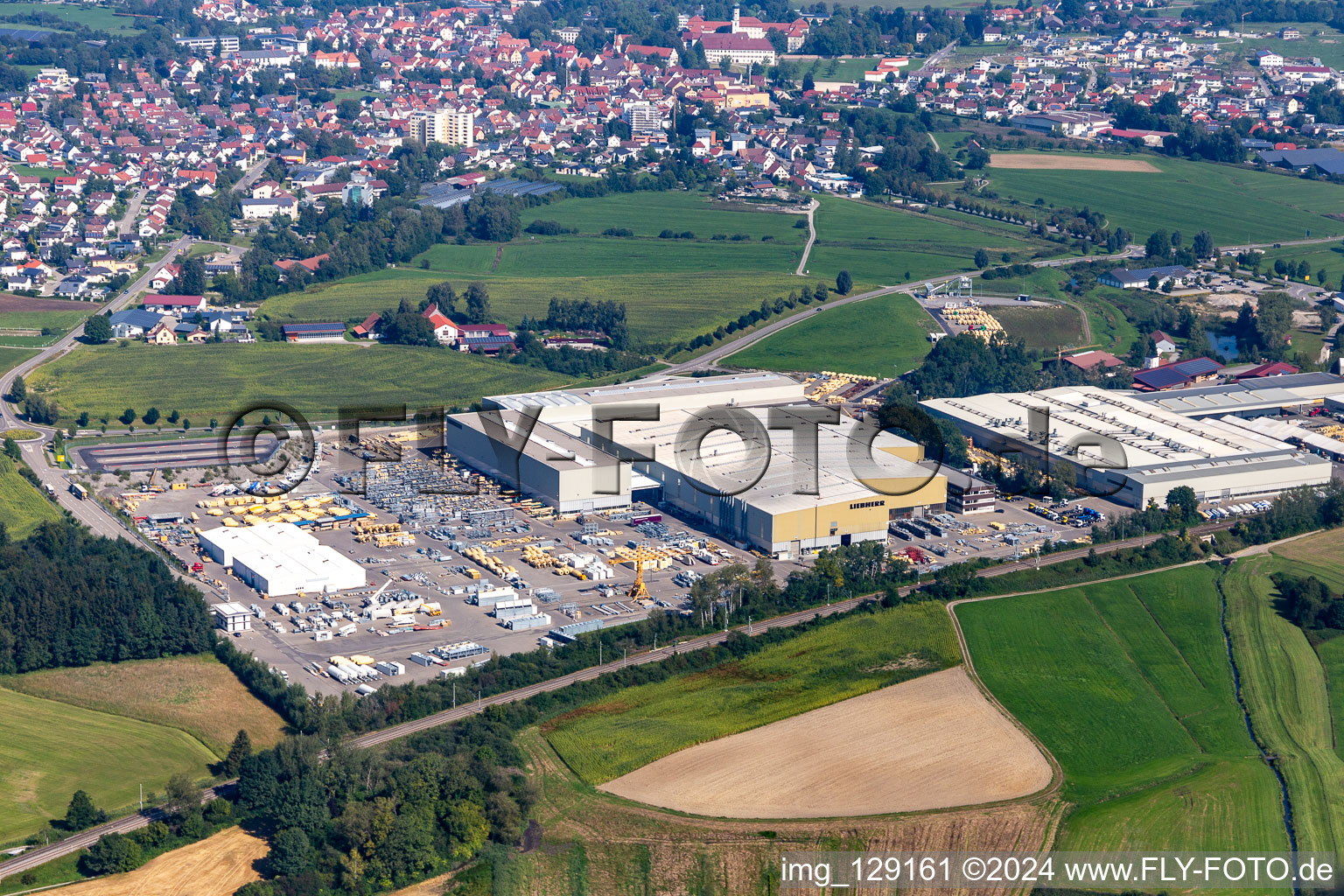 Building and production halls on the premises of Liebherr-Mischtechnik GmbH in Bad Schussenried in the state Baden-Wuerttemberg, Germany from the plane