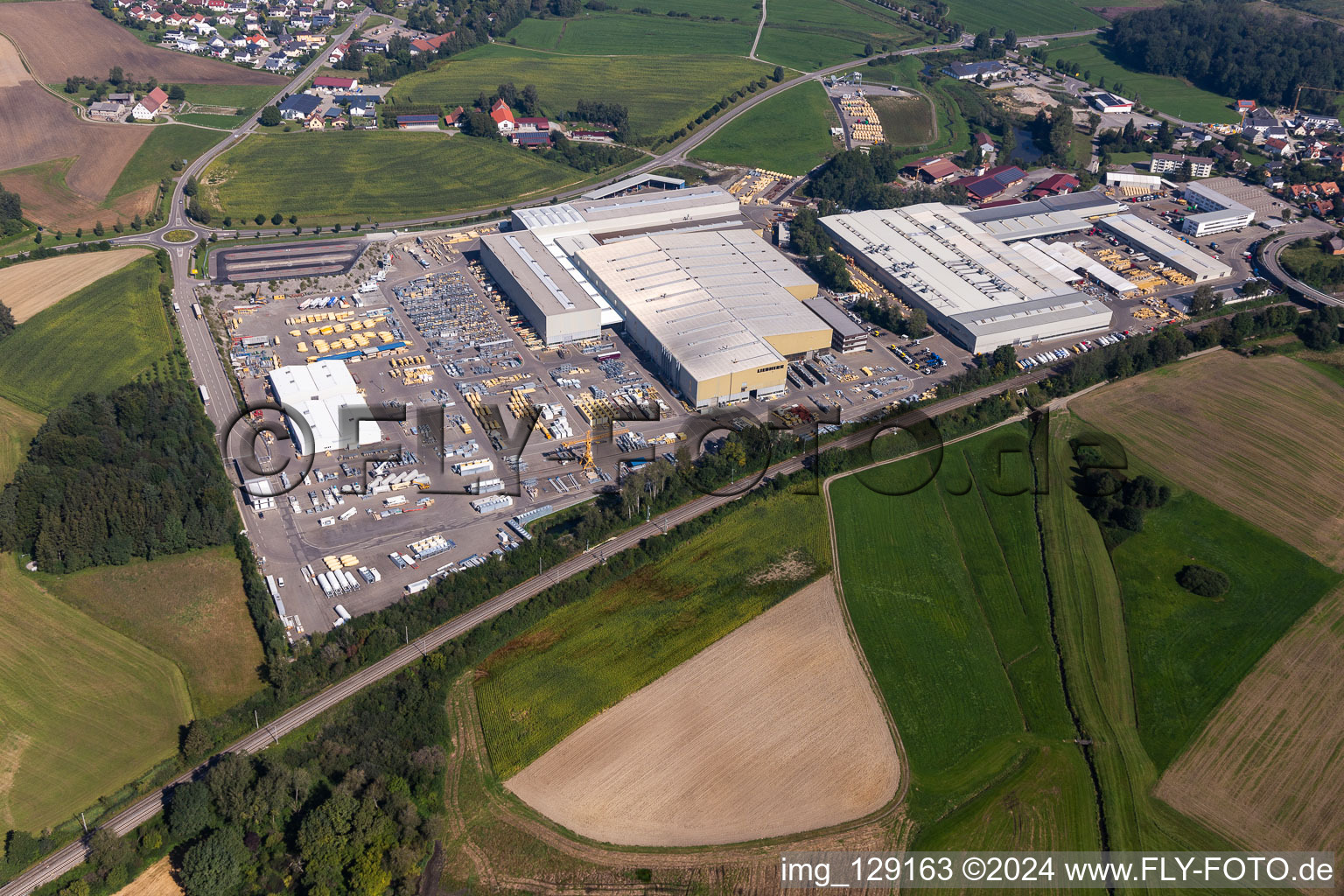 Bird's eye view of Building and production halls on the premises of Liebherr-Mischtechnik GmbH in Bad Schussenried in the state Baden-Wuerttemberg, Germany