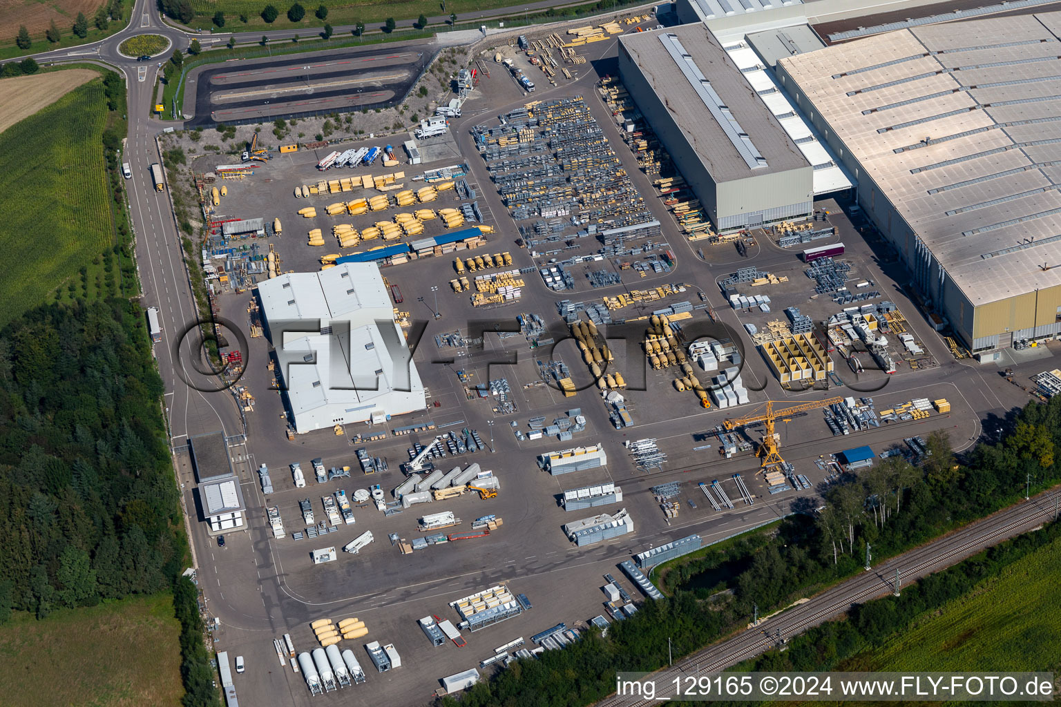 Building and production halls on the premises of Liebherr-Mischtechnik GmbH in Bad Schussenried in the state Baden-Wuerttemberg, Germany viewn from the air