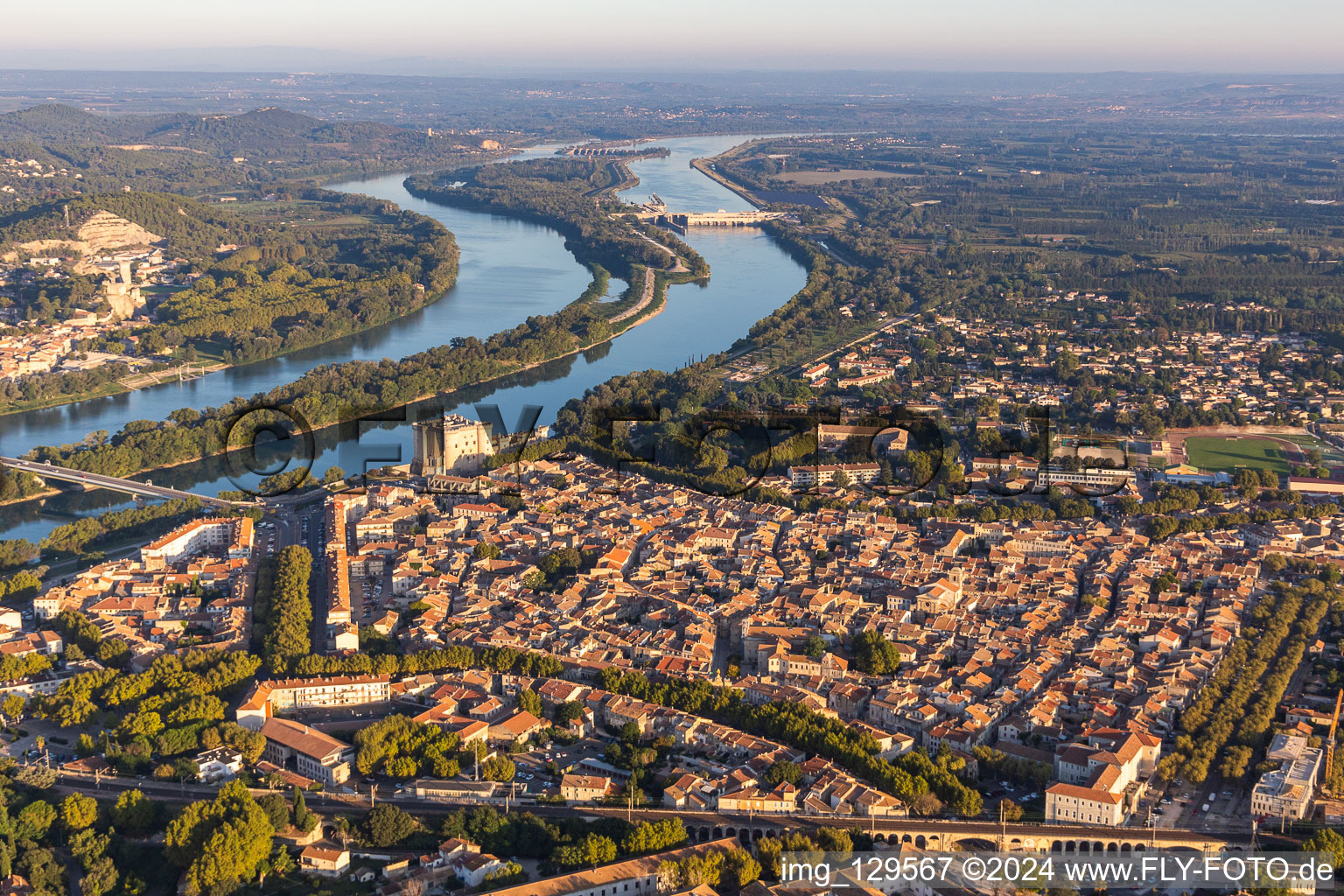 City view on the river bank of the river Rhone with castle Chateau de Tarascon in Tarascon in Provence-Alpes-Cote d'Azur, France