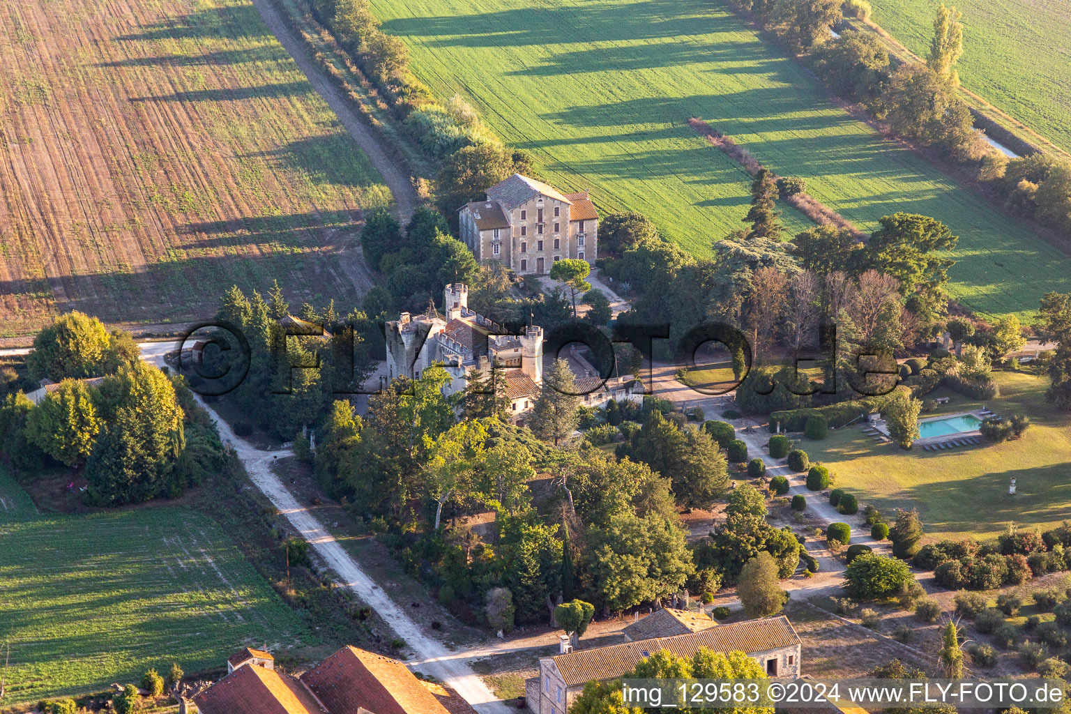 Buildings and parks at the mansion of the farmhouse Clamasix Domaine Breuil in Saint-Etienne-du-Gres in Provence-Alpes-Cote d'Azur, France