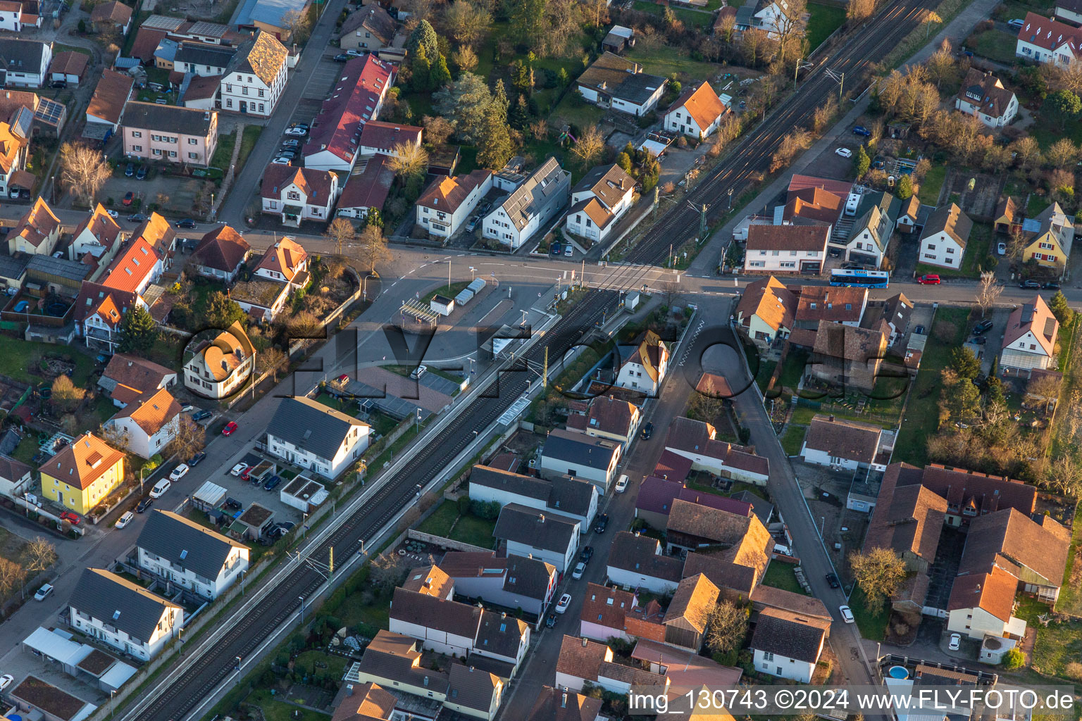 Aerial view of Mühlgasse railway crossing in Rheinzabern in the state Rhineland-Palatinate, Germany