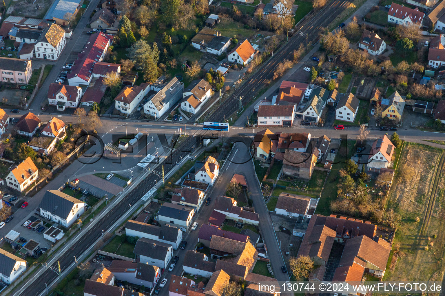 Aerial photograpy of Mühlgasse railway crossing in Rheinzabern in the state Rhineland-Palatinate, Germany