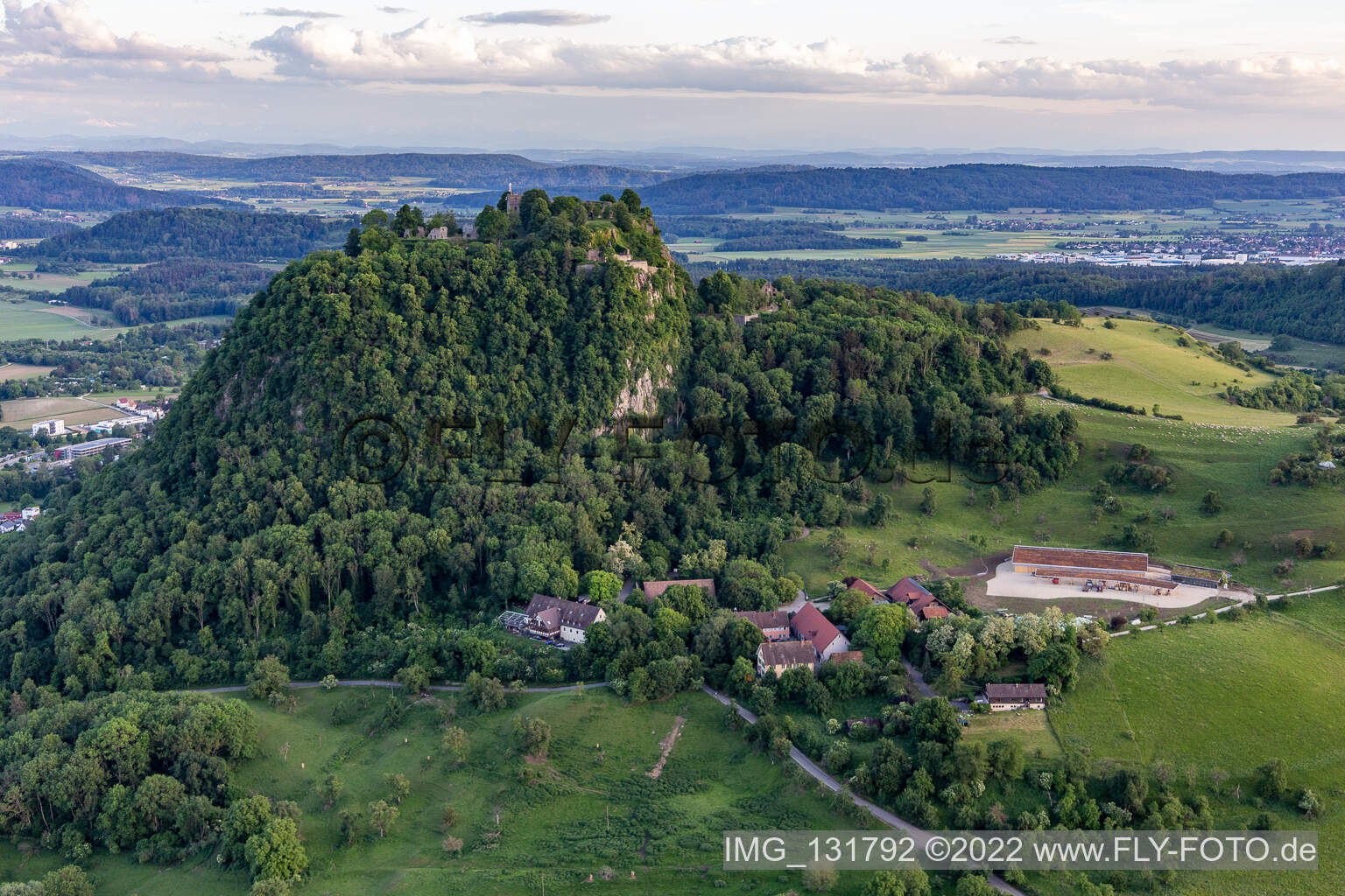 Aerial view of Hohentwiel with fortress ruins from 914 and panoramic views is an extinct volcano in Singen in the state Baden-Wuerttemberg, Germany