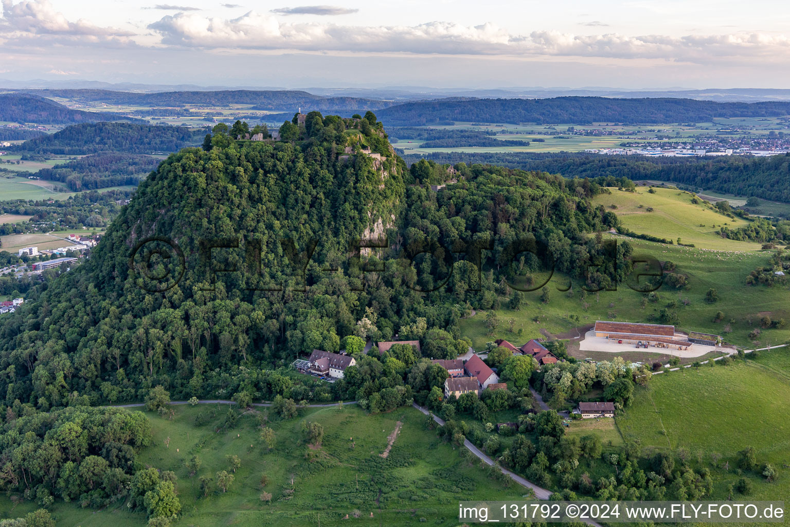 Aerial view of Hohentwiel with fortress ruins from 914 and panoramic views is an extinct volcano in Singen in the state Baden-Wuerttemberg, Germany