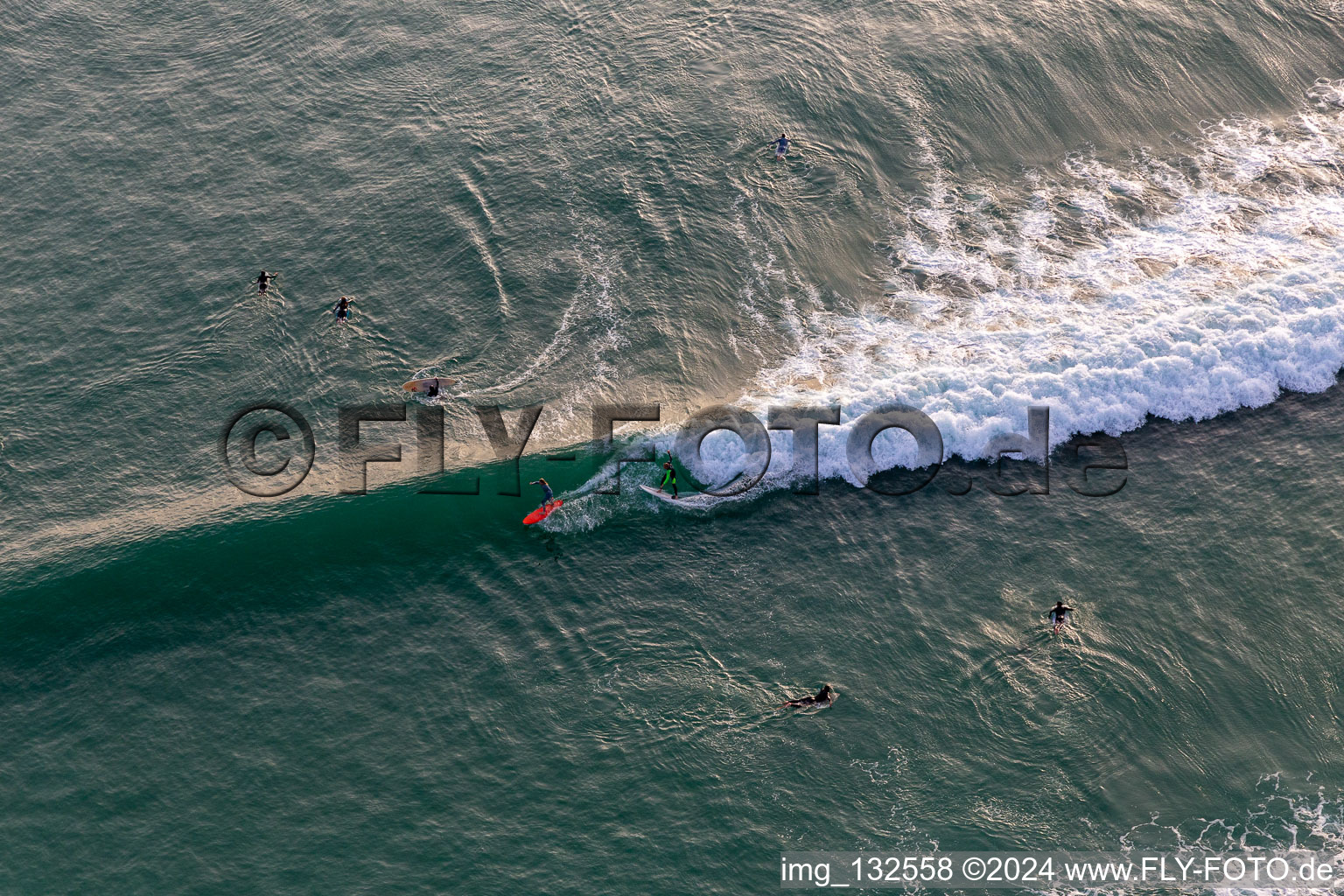 Surfers in front of the Plage de Tronoën/Brittany in Saint-Jean-Trolimon in the state Finistere, France