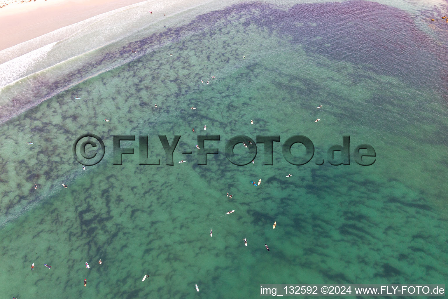 Aerial photograpy of Surfers waiting for the wave in front of the Plage la Torche-Tronoën in Plomeur in the state Finistere, France